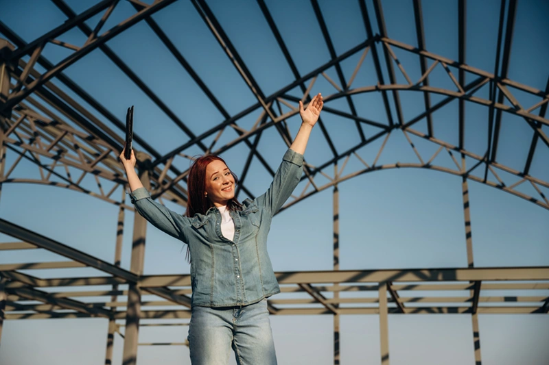 happy woman in a barndominium build after using home builder marketing agency pixeldrip